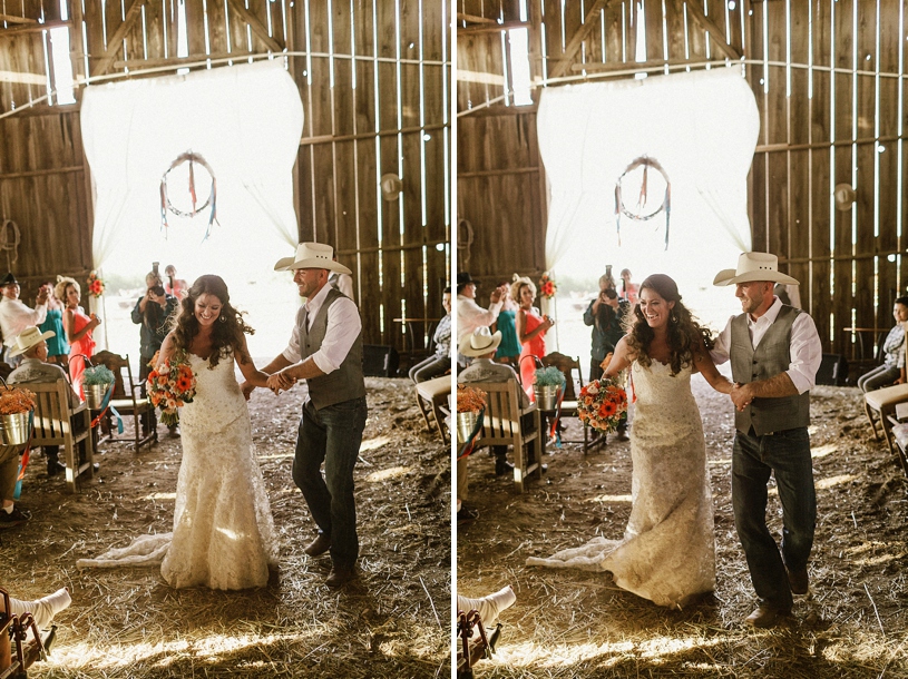 bride and groom dancing as they leave their barn ceremony by heather elizabeth photography